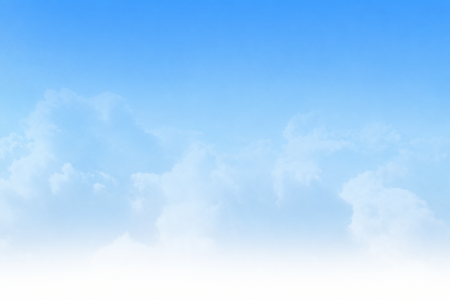 Soft white clouds against a clear blue sky